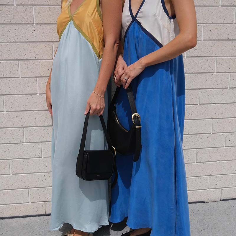 Fashionable V-neck sleeveless color blocked oversized dress with V-neck design, showcasing elegant neck lines